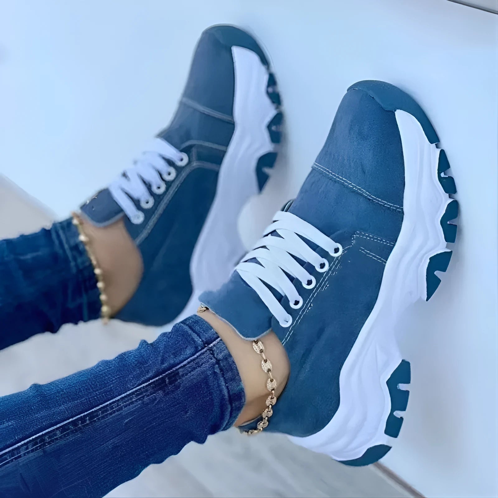 Women's platform lace-up sneaker with rubber sole, round toe, and thick platform in solid red colour