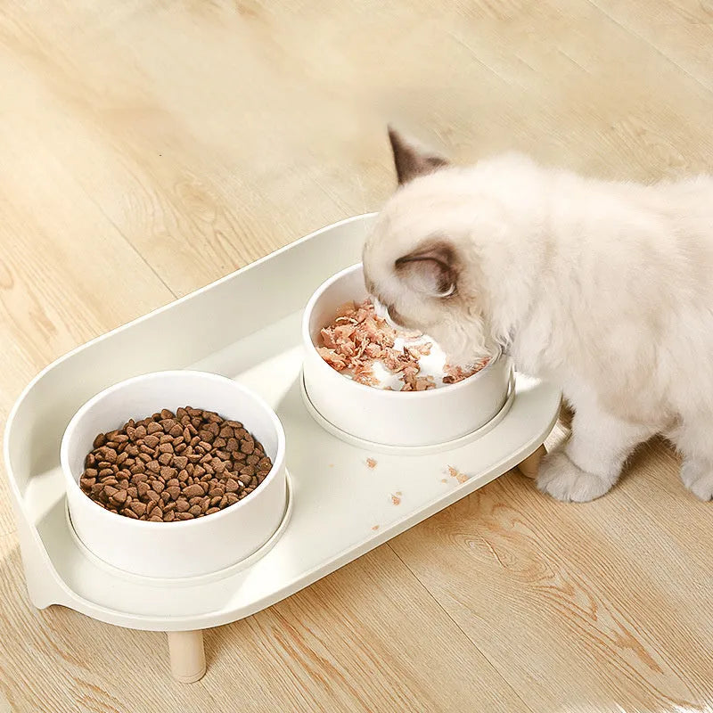 Green adjustable pet bowl set with tilted double compartments for food and water feeding