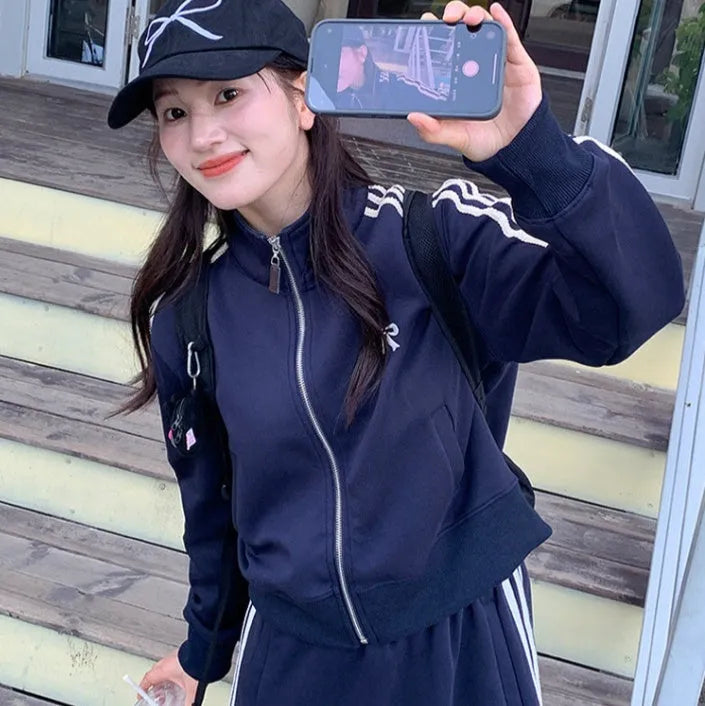 Women's retro baseball jacket in slim fit polyester with front pockets, available in navy blue or gray