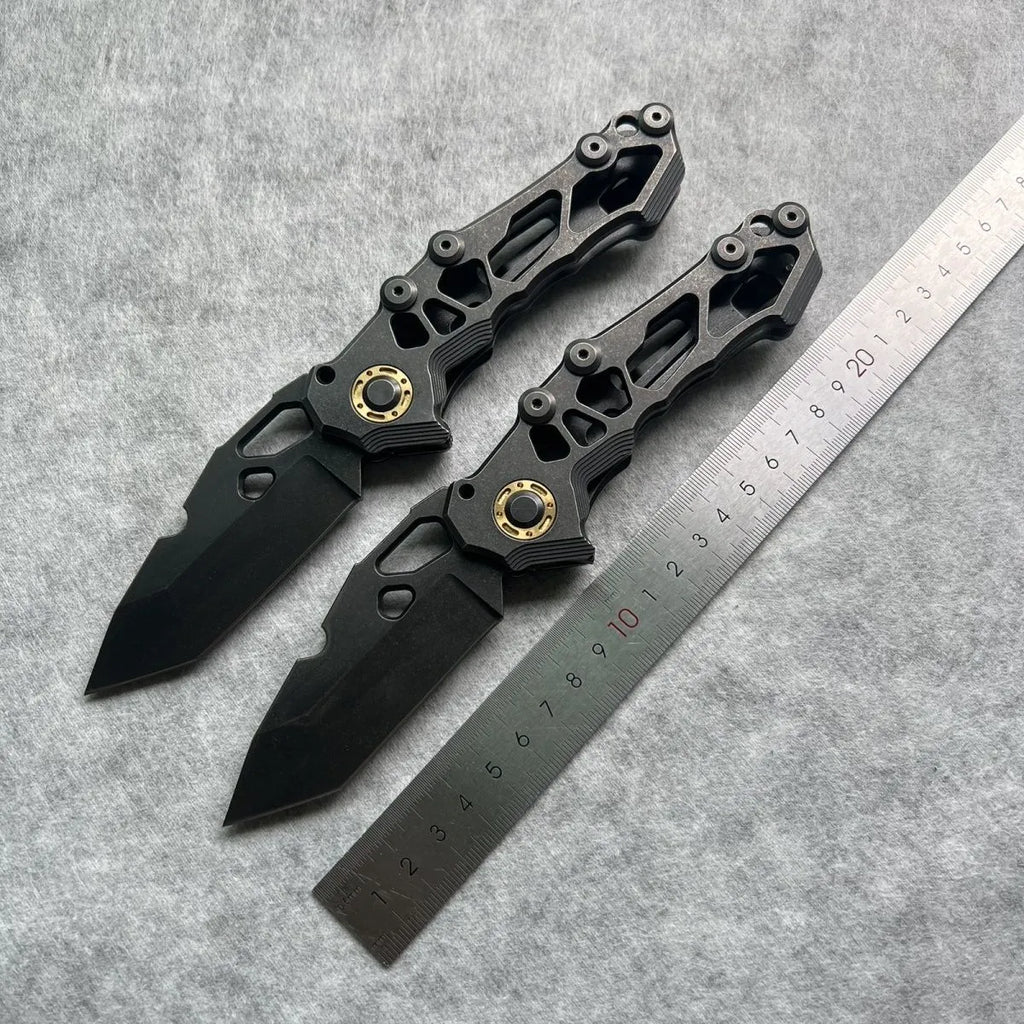 D2 steel folding knife with 9cm blade on outdoor background