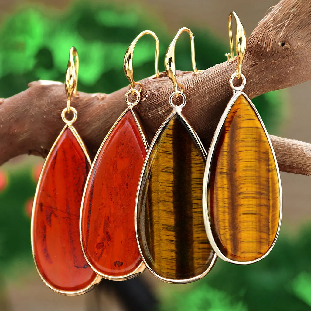 Vintage Tigereye long water drop stone earrings showing textured surface and elongated silhouette