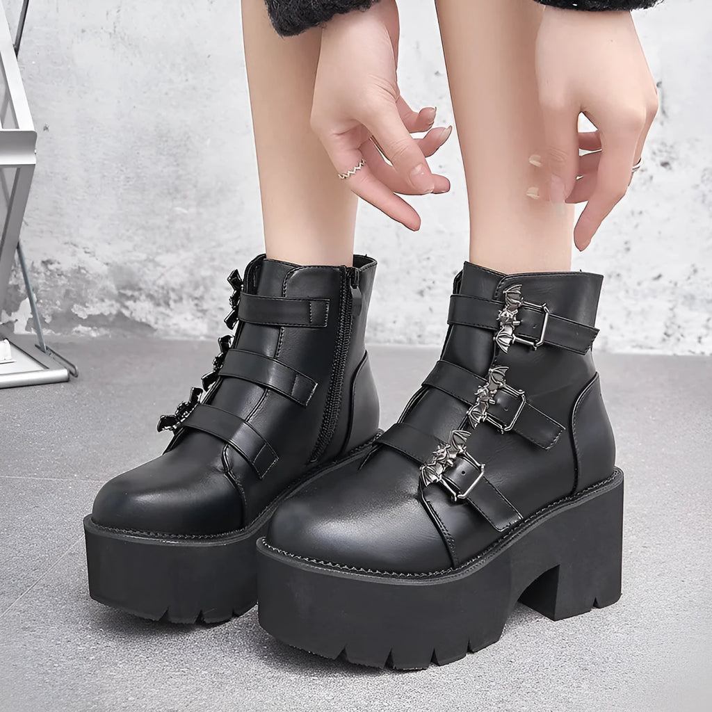 Black women's Harajuku-style punk ankle boots with bat buckle and chunky platform heel.