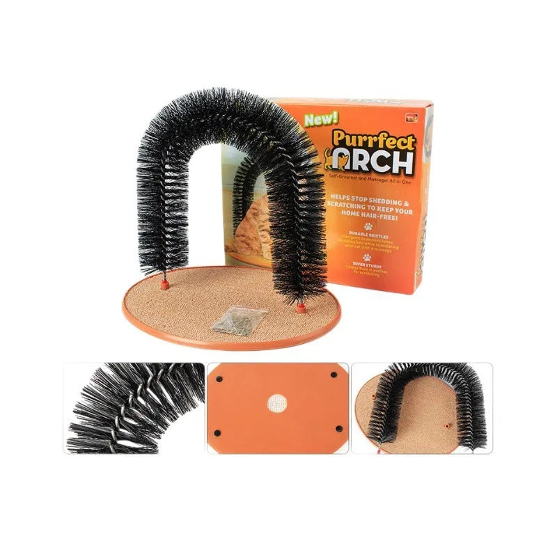 White plastic cat grooming arch scratcher toy with built-in brush bristles on a wooden floor.