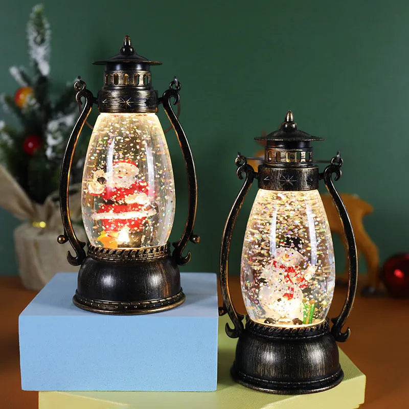 Plastic crystal ball LED oil lamp Christmas ornament with snowman or elderly design on desktop.