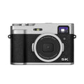 Black and brown 5K digital camera with dual lenses, optical viewfinder, and a 2.88-inch screen.