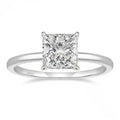 A polished geometric sterling silver ring for women on a grey background.