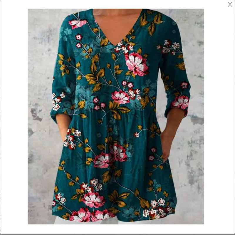 Women's printed loose-fit maxi dress with wide waist and three-quarter length sleeves.