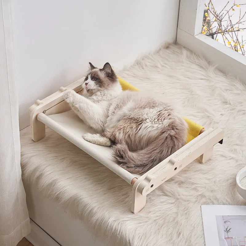 Solid wood raised pet bed with removable cushion in plaid pattern for cats and dogs