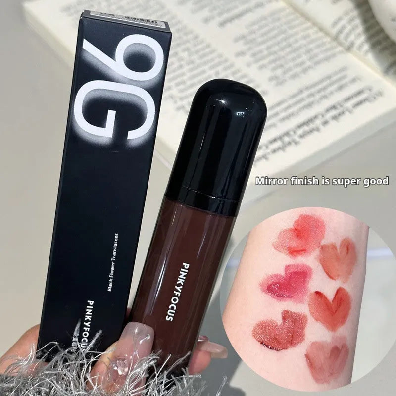 Mirror Lip Lacquer in glossy black finish showing six colour shades from tomato red to sweet potato purple