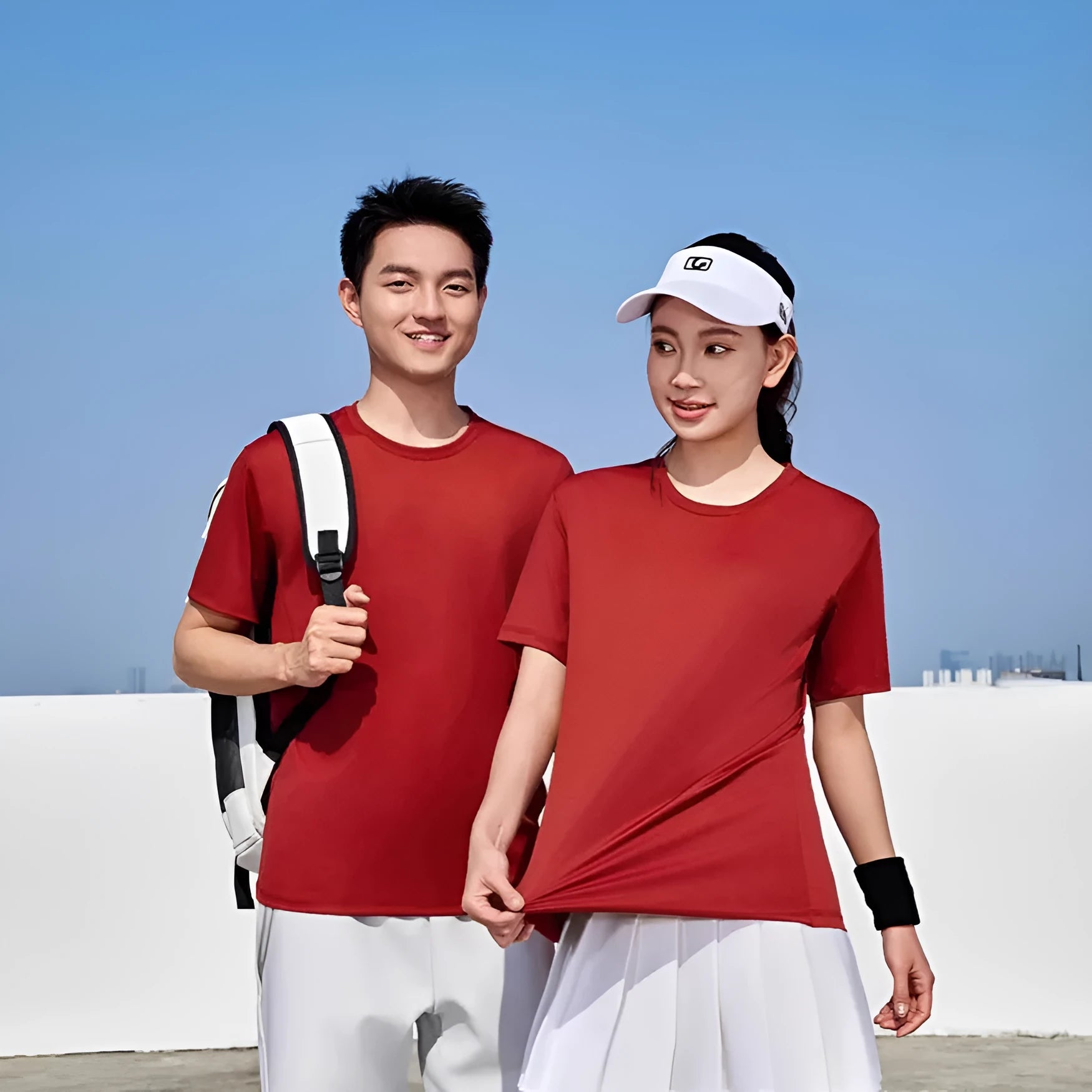 Men's solid colour loose-fit polyester t-shirt with round neck and short sleeves on a hanger.