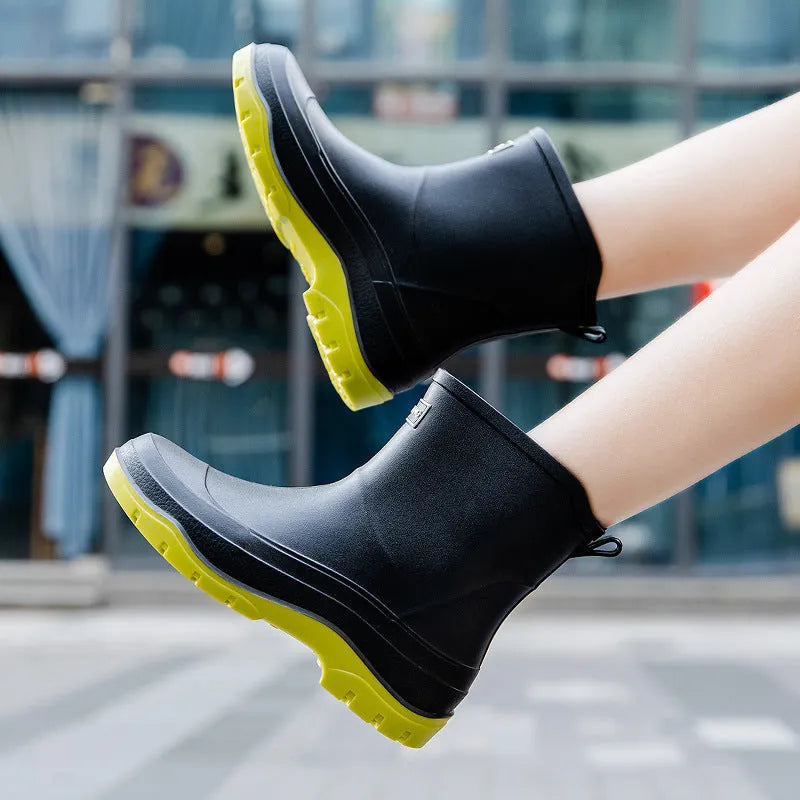 Women's short waterproof rubber shoe with non-slip sole in white colour on a flat heel.