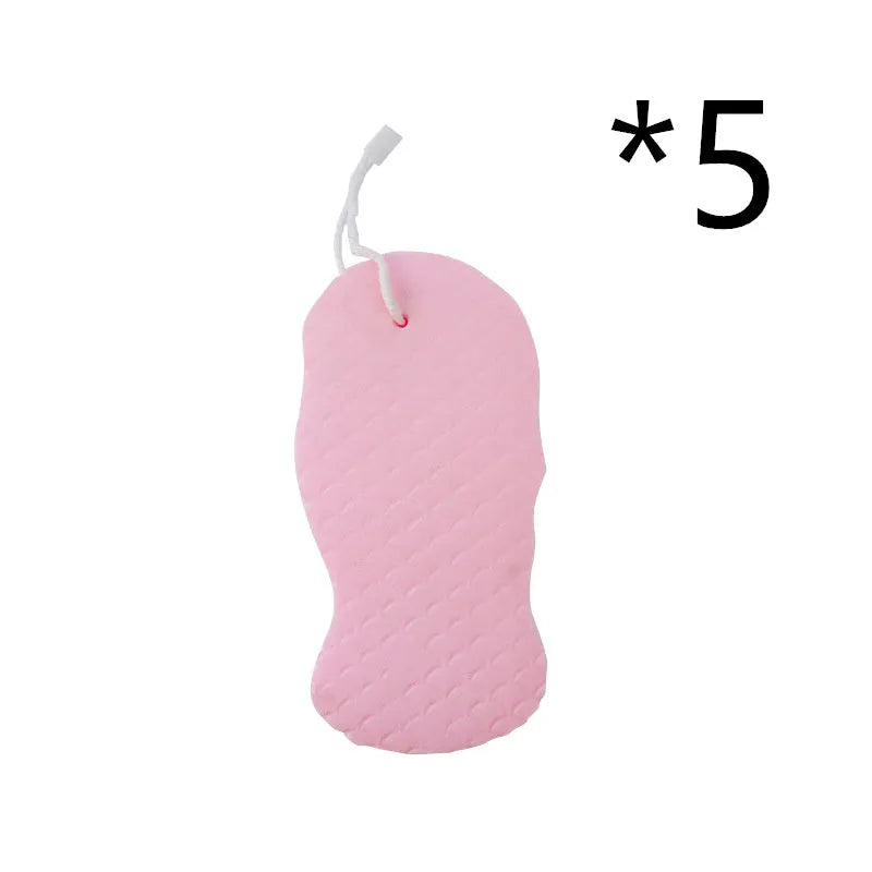 White 3D fish scale pattern bath sponge ball on a bathroom surface.