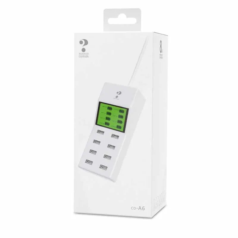 White multi-port USB mobile phone charger with UK, EU, US plug adapters on a desk
