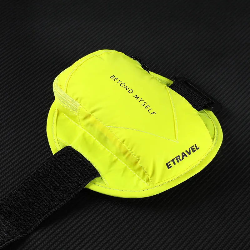 Reflective black running arm bag with adjustable strap shown on an arm.