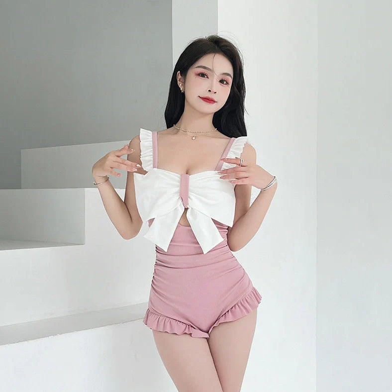 Women's one-piece swimsuit with adjustable bow detailing and milk silk fabric, available in sizes S to XL with three colour options for swimming and wading activities