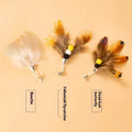 Three steel wire cat toy replacement heads with small flying insect designs in assorted colours.