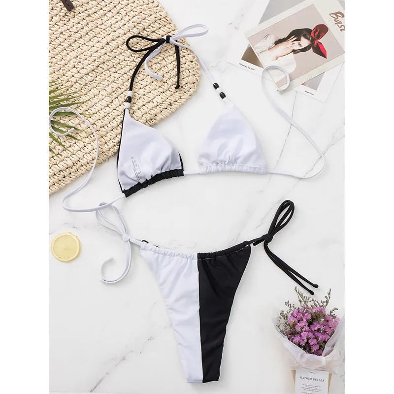 Black and white women's lace-up triangle cup bikini swimsuit with briefs-style bottom