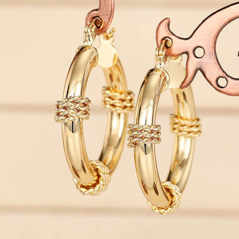 Geometric copper ring ear clip for women in a golden colour.
