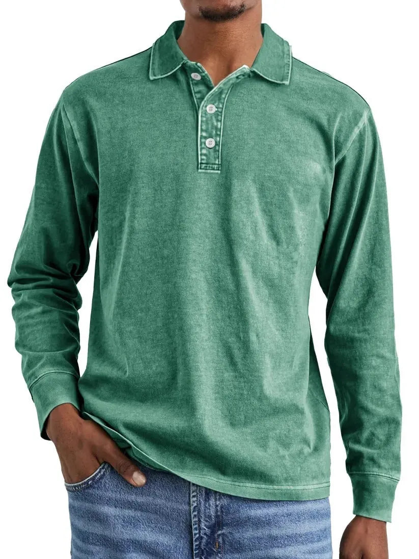Man wearing a retro washed grey cotton polo shirt with distressed details and a lapel collar.