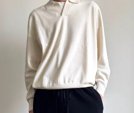 Pure wool polo sweater with a lapel collar in milky white, showing loose fit and long sleeves.