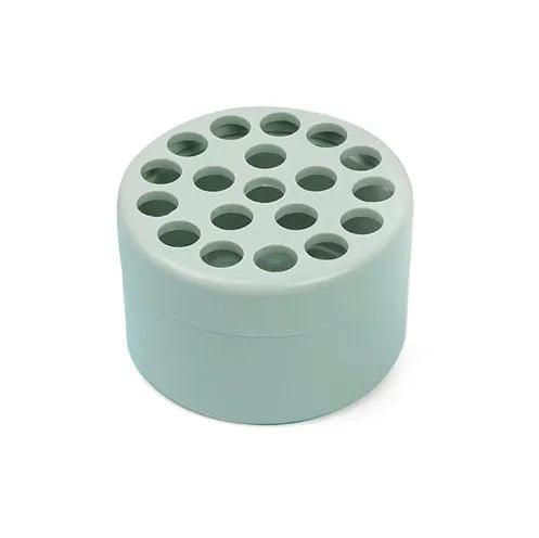 Plastic spiral stem bracket flower arrangement tool in green, with spiral design for holding stems in a vase