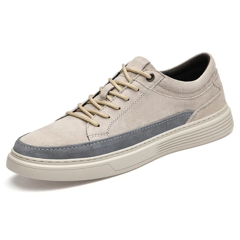 Men's grey pigskin leather low-top casual skate shoes with round toe and flat rubber sole.