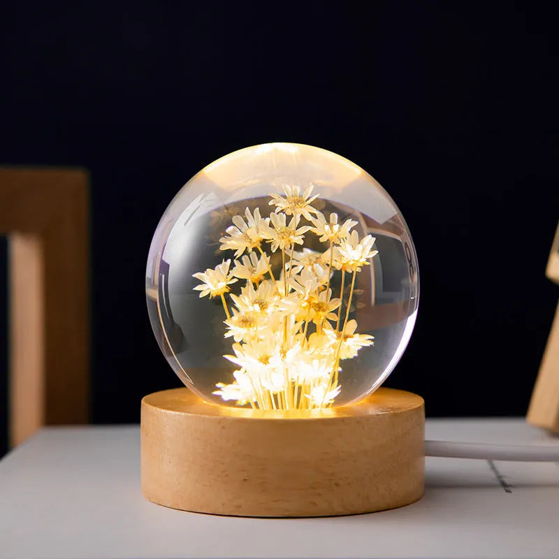3D dandelion crystal ball desk lamp on beech wood stand, serving as a USB night light.
