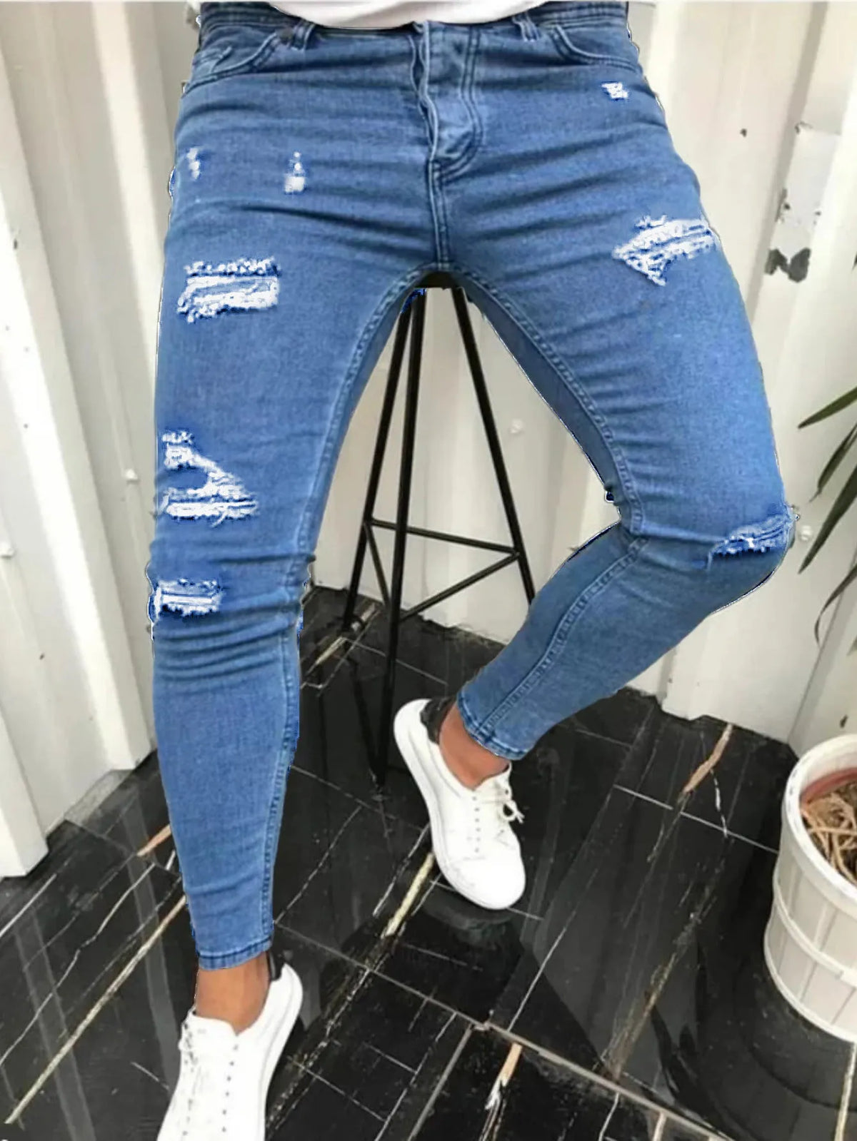 Tight ripped skinny solid colour men's denim trousers with mid waist and zipper fly