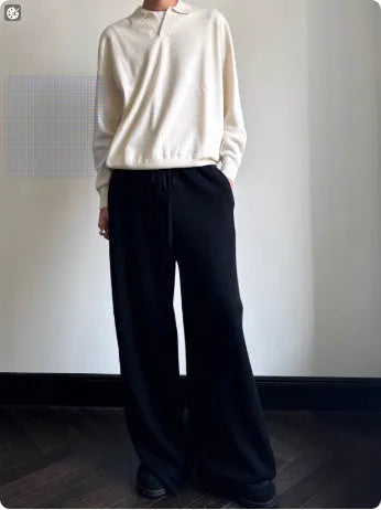 Pure wool polo sweater with a lapel collar in milky white, showing loose fit and long sleeves.