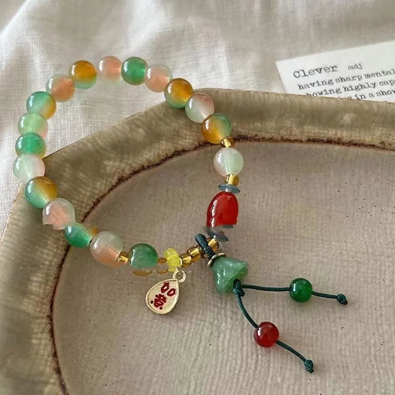 Handmade mixed material bracelet featuring a Lotus and Ruyi charm design, M990 style.