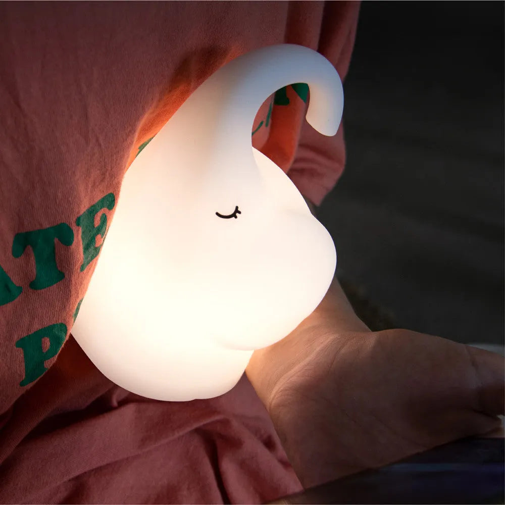 White DOMI elephant-shaped cordless silicone night light on a surface.