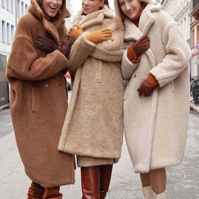 Women's lapel lamb fleece coat with faux fur lining and pockets for winter warmth