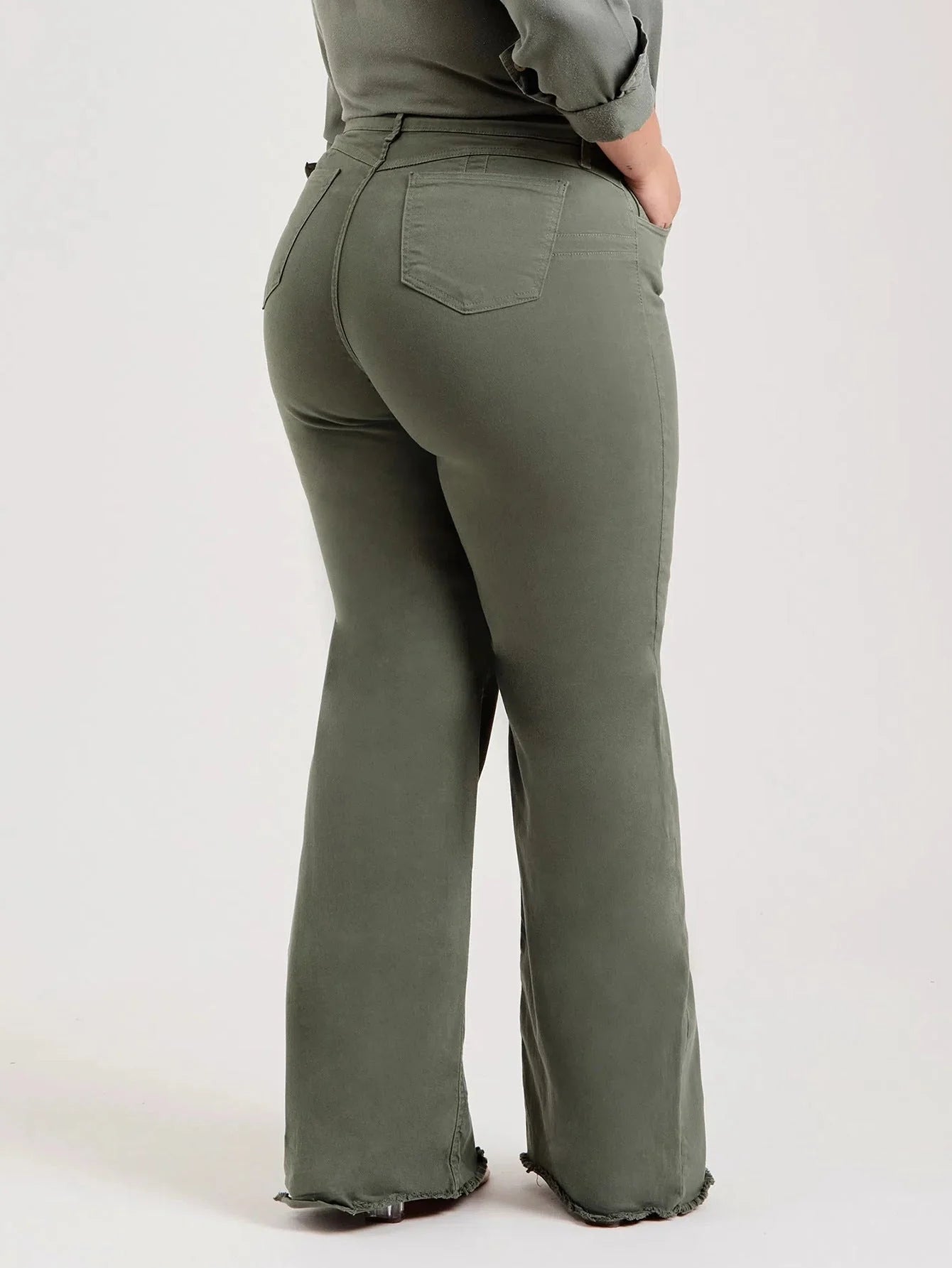Slim fit stretch denim flared pants in olive green with a mid-waist design and zipper detail