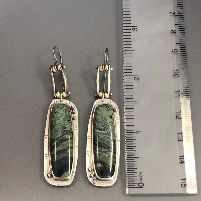 Geometric-shaped alloy earrings with a white and grey two-tone marble pattern.