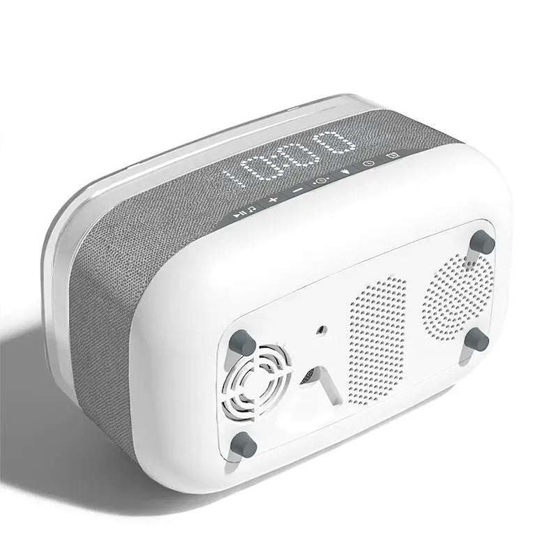 White multifunctional alarm clock with Bluetooth speaker and wireless charging pad for mobile phones