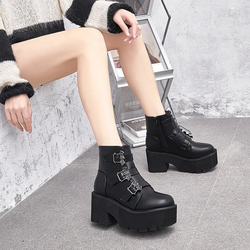 Black women's Harajuku-style punk ankle boots with bat buckle and chunky platform heel.