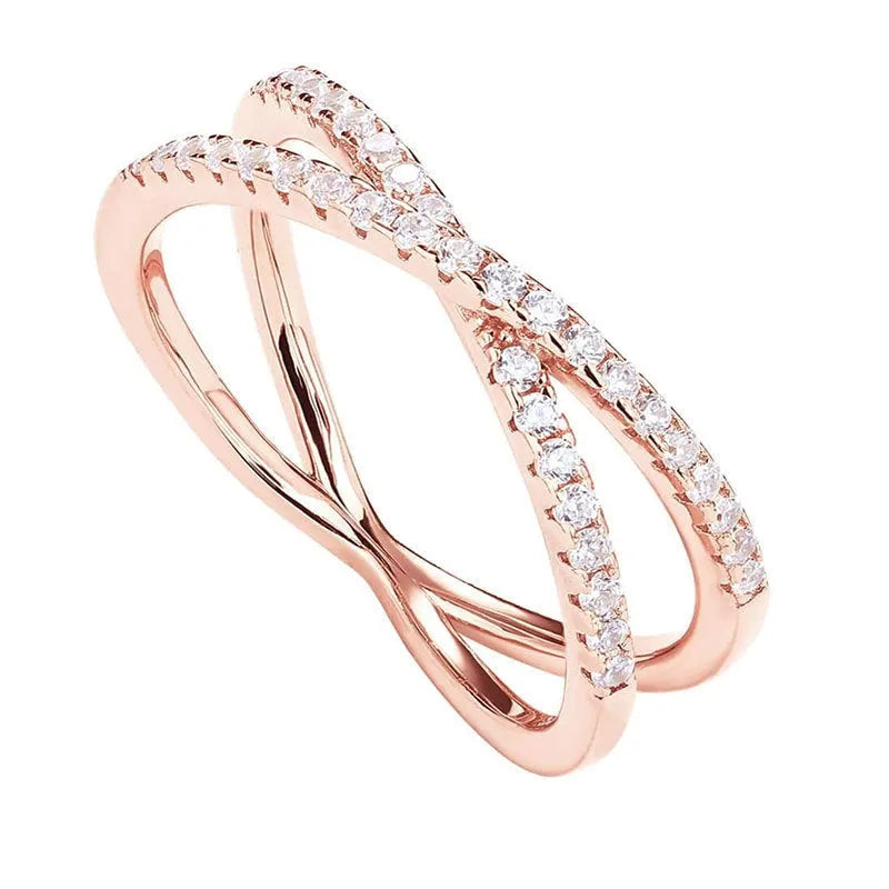 Silver cross ring with diamond accents in half circle wide band design on white background