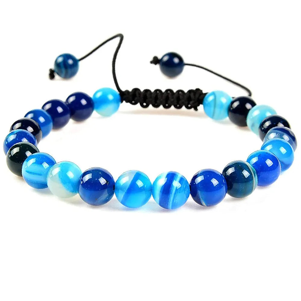 Women's flat knot braided bracelet in aquamarine with geometric woven patterns.