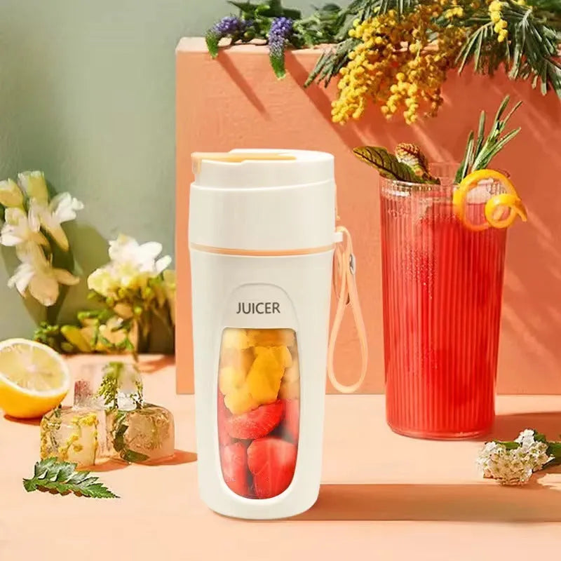 Fresh Orange portable USB blender with borosilicate glass cup on a table