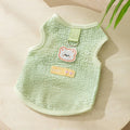 Green knitted cat clothing with a hollowed-out cartoon bear patch design