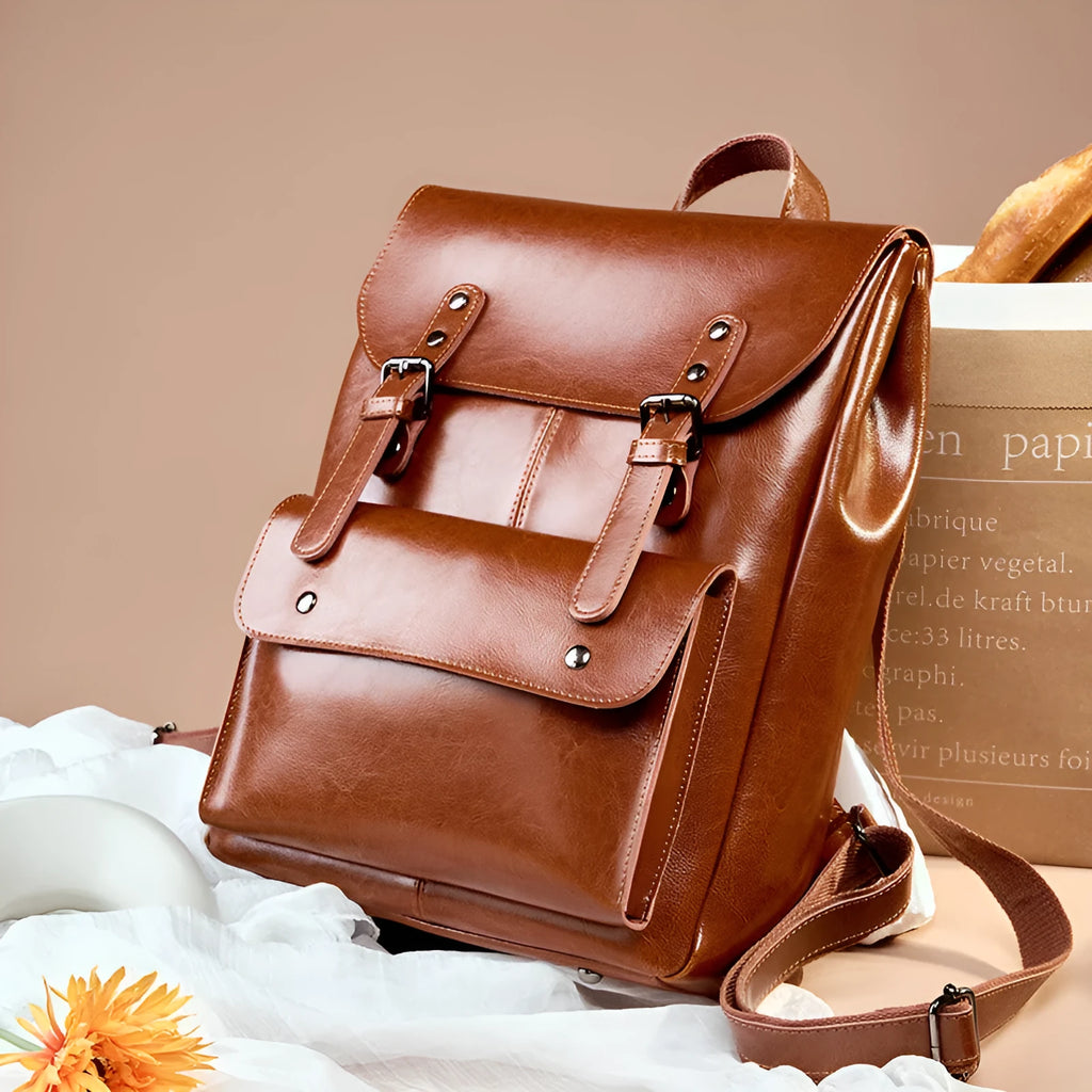 Women's structured backpack in genuine cowhide leather, shown in black, brown, and coffee colour options.