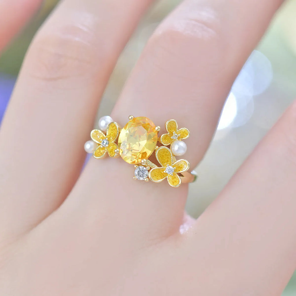 Women's open ring with flower design and zircon detail in light purple or yellow colour options