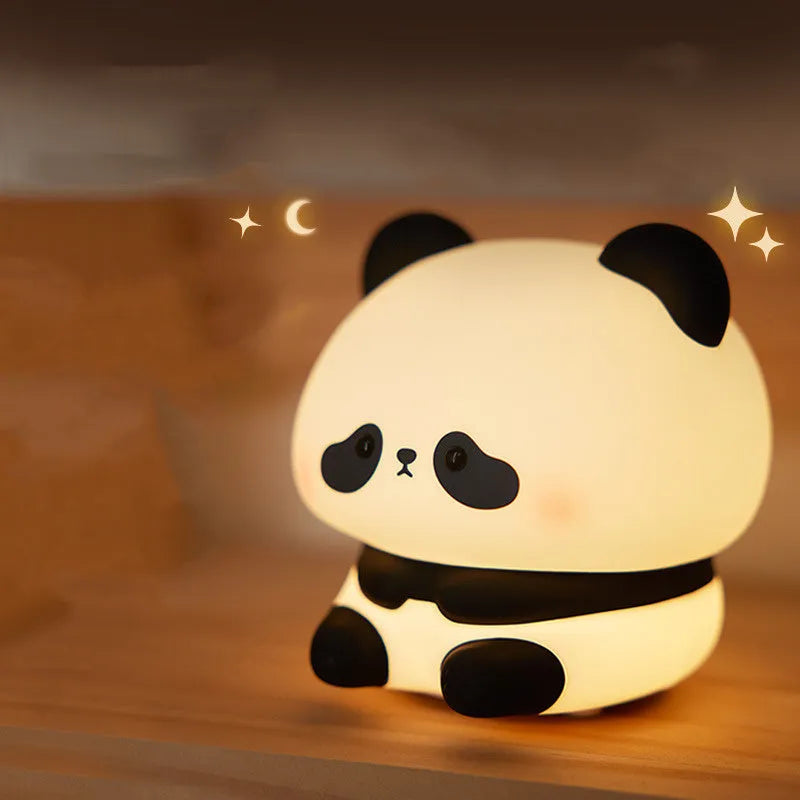 Cartoon panda-shaped night light made from blue silicone with clap activation feature