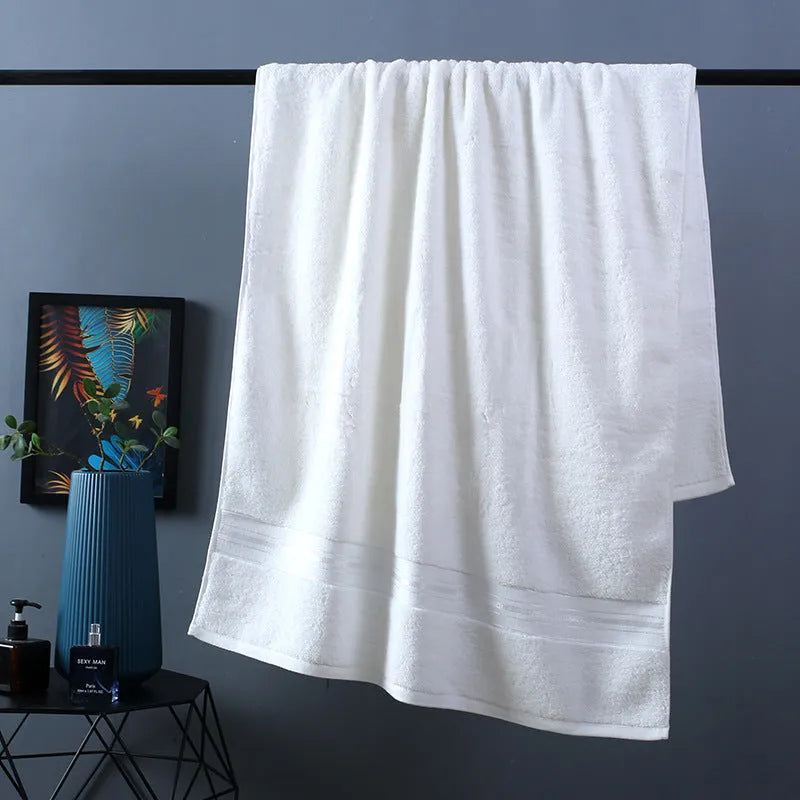 Pure cotton three-piece towel set showing bath towel, hand towel, and square scarf in a blue colour option.