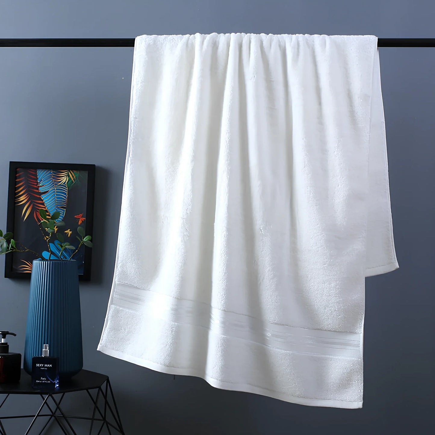 Three-piece cotton bath towel set in blue, featuring 70x150cm bath towel, 34x75cm hand towel, and 34x35cm square scarf for absorbent drying