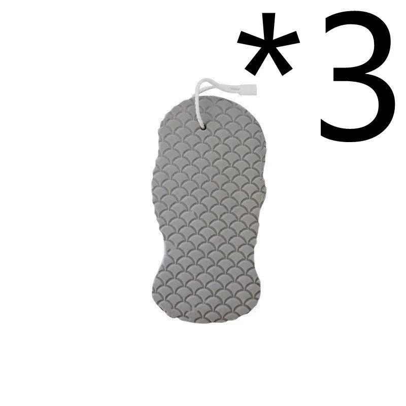 White 3D fish scale pattern bath sponge ball on a bathroom surface.