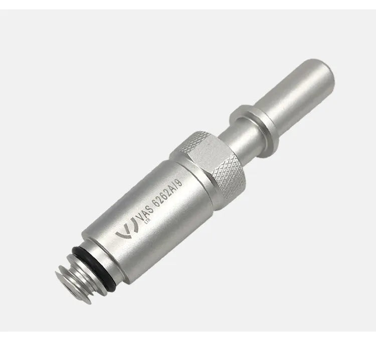 Silver metal VAS6262-9 transmission oil refueling adapter tool on a workshop bench.