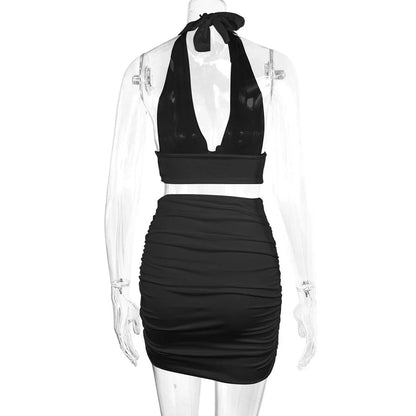 Women's halter lace-up top and pleated skirt set in polyester, available in white, black, and pea green
