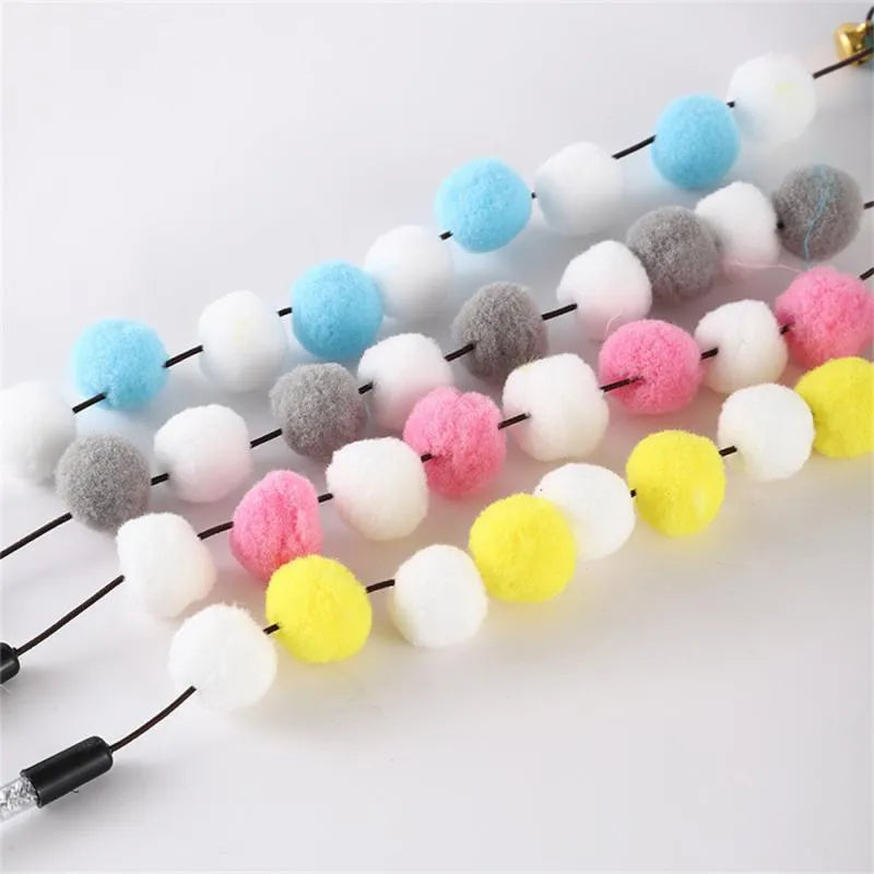 31cm long cat teaser rod with feather and bell attachment in multiple colour options