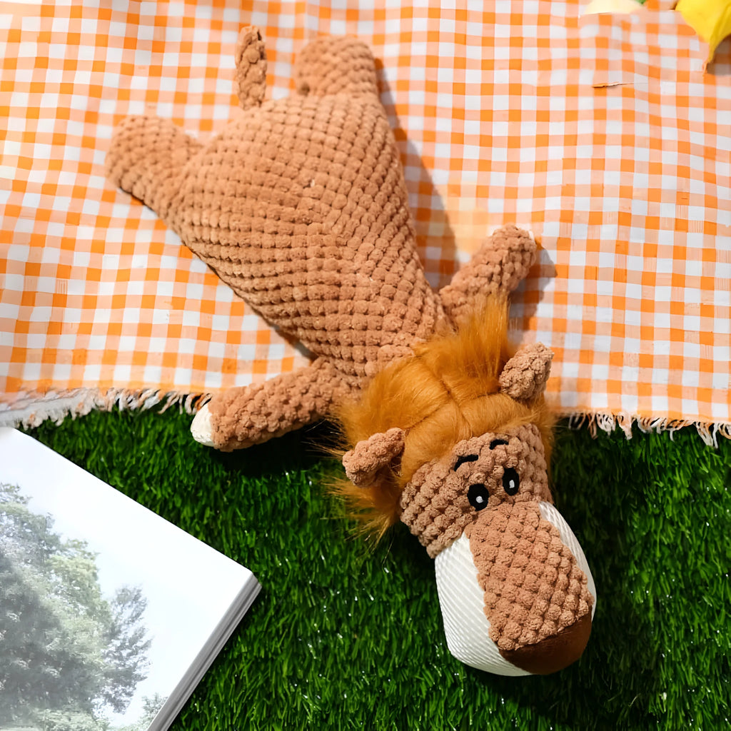 Green, grey, and yellow corn-shaped plush dog toys with a grunting sound device.